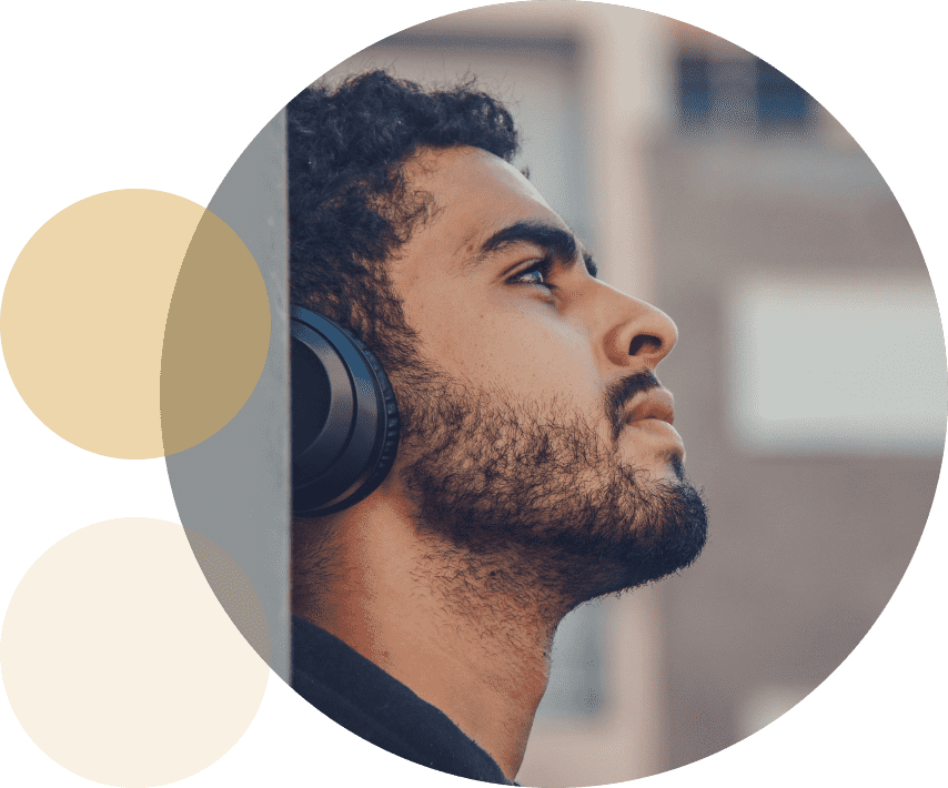A man listening to a Guidelines devotional through headphones