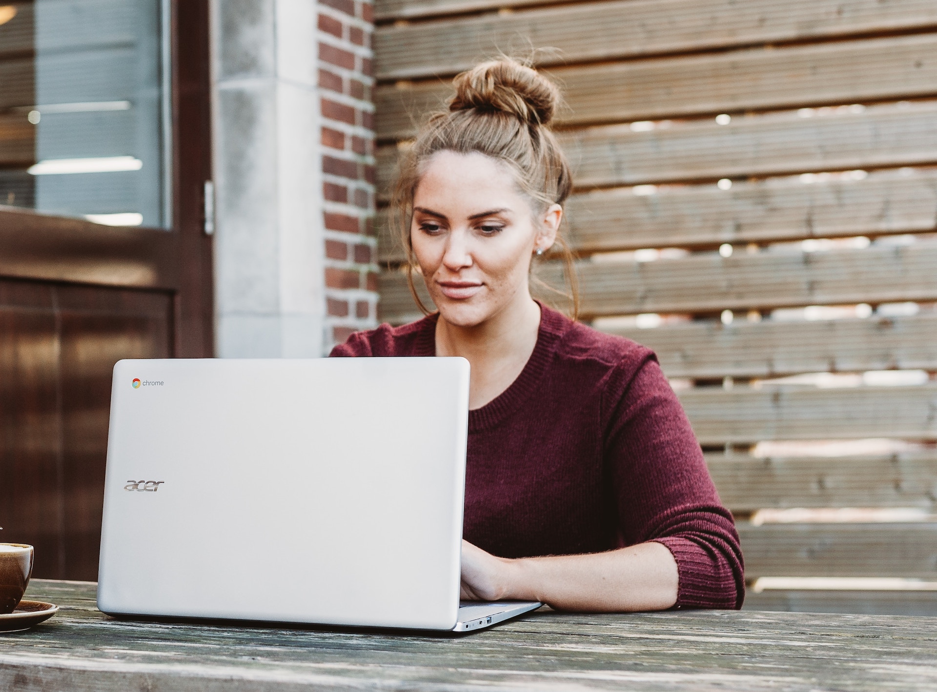 girl-laptop-table-volunteer girl-laptop-table-volunteer